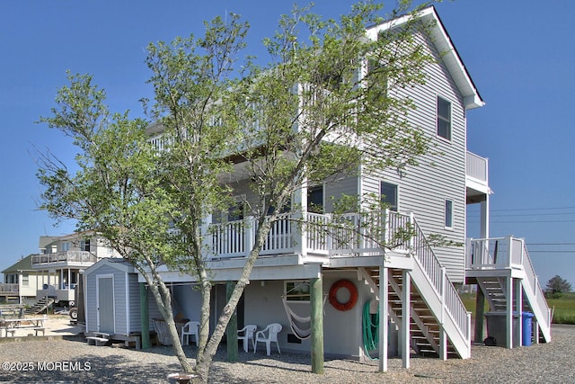 1255 W Mallard Dr, Stafford, NJ 08050 - view of front of property with stairway, a wooden deck, a shed, and an outdoor structure