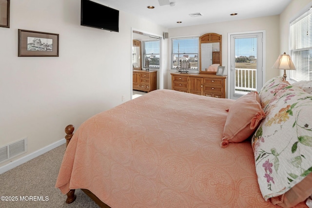 1255 W Mallard Dr, Stafford, NJ 08050 - carpeted bedroom with access to exterior and baseboards