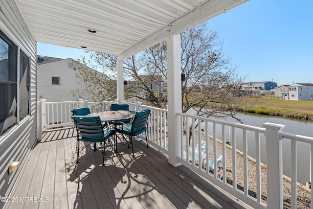 1255 W Mallard Dr, Stafford, NJ 08050 - wooden deck with a water view and outdoor dining space