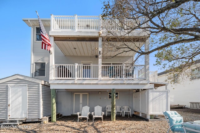 1255 W Mallard Dr, Stafford, NJ 08050 - rear view of house featuring a shed, an outbuilding, and a wooden deck