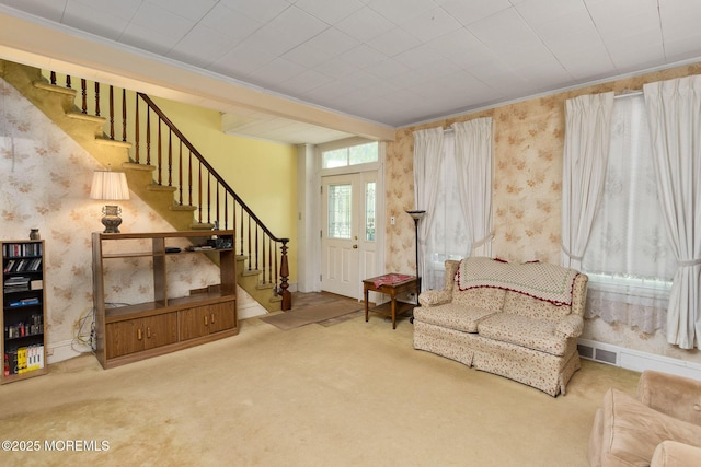 38 Bowne Ave, Freehold, NJ 07728 - living area with stairs, wallpapered walls, carpet floors, and crown molding