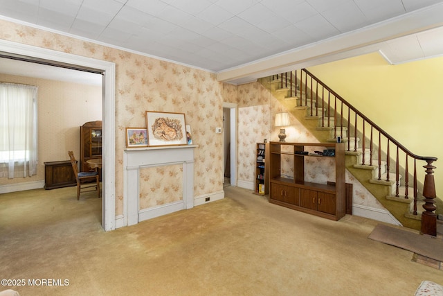 38 Bowne Ave, Freehold, NJ 07728 - unfurnished living room with stairway, wallpapered walls, carpet floors, crown molding, and baseboards