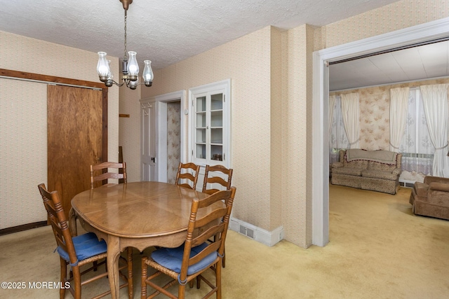 38 Bowne Ave, Freehold, NJ 07728 - dining area with wallpapered walls, light colored carpet, a chandelier, baseboards, and a textured ceiling