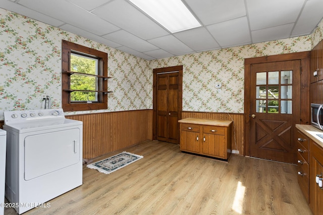 38 Bowne Ave, Freehold, NJ 07728 - washroom featuring washer / clothes dryer, wainscoting, cabinet space, light wood-style flooring, and wallpapered walls