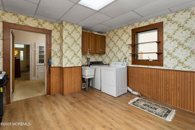38 Bowne Ave, Freehold, NJ 07728 - washroom with cabinet space, wallpapered walls, wainscoting, light wood-style floors, and washing machine and dryer
