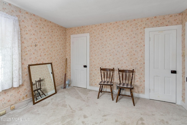 38 Bowne Ave, Freehold, NJ 07728 - sitting room with wallpapered walls, carpet, and baseboards