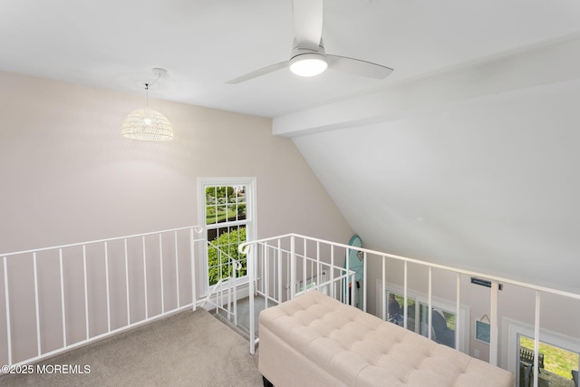 additional living space featuring carpet, ceiling fan, and vaulted ceiling