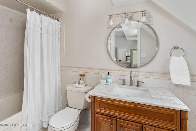 full bath with tile walls, vanity, toilet, wainscoting, and shower / bathtub combination with curtain