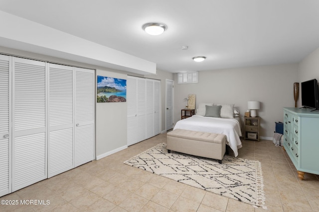 bedroom featuring baseboards and light tile patterned floors