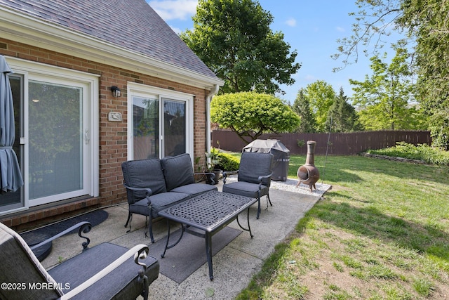 view of patio / terrace with an outdoor living space and a grill