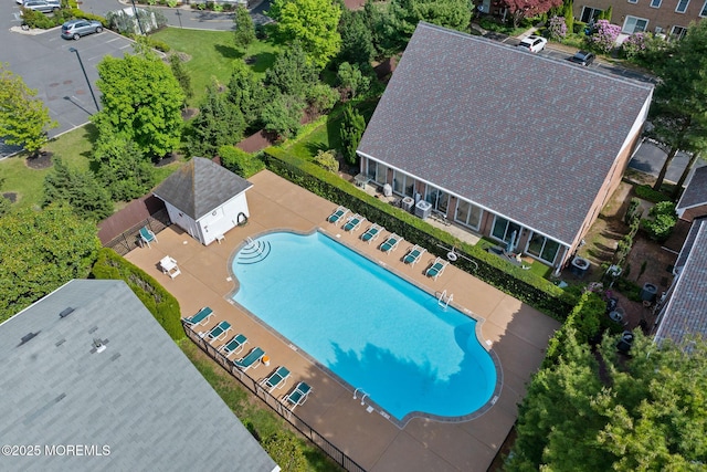 aerial view of property and surrounding area with a pool
