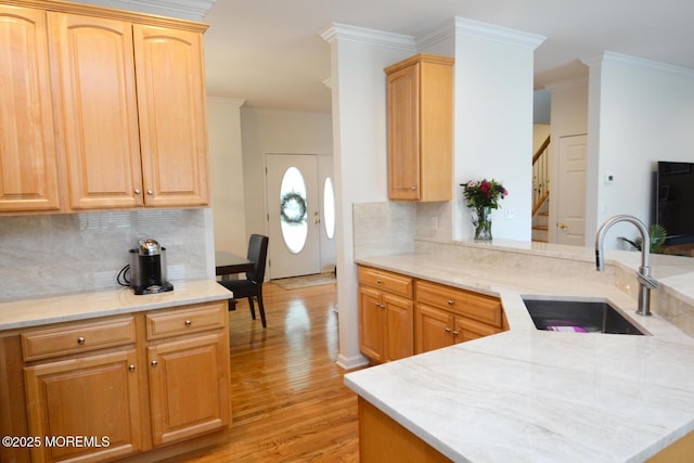 630 Springfield Ave, Pine Beach, NJ 08741 - kitchen with a sink, ornamental molding, light wood-style flooring, backsplash, and a peninsula