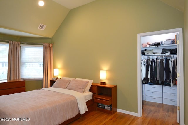 630 Springfield Ave, Pine Beach, NJ 08741 - bedroom with a spacious closet, wood finished floors, a closet, high vaulted ceiling, and baseboards