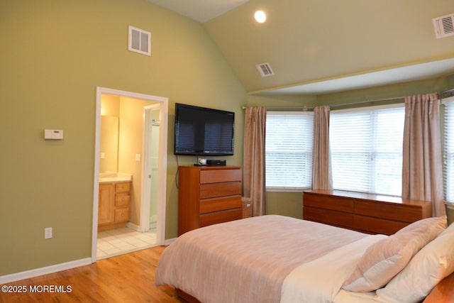 630 Springfield Ave, Pine Beach, NJ 08741 - bedroom featuring light wood-style floors, high vaulted ceiling, ensuite bath, and baseboards