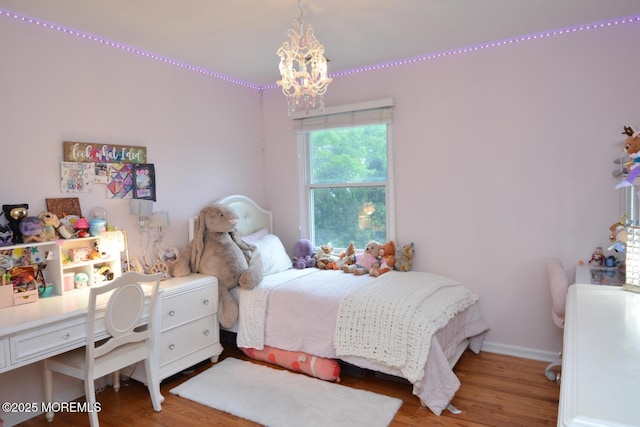 630 Springfield Ave, Pine Beach, NJ 08741 - bedroom featuring a chandelier, wood finished floors, and baseboards