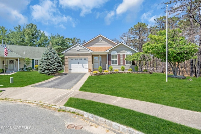 235 Prince Charles Ct, Toms River, NJ 08757 - single story home featuring an attached garage, asphalt driveway, a front lawn, and brick siding