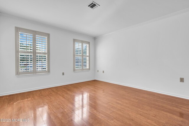 235 Prince Charles Ct, Toms River, NJ 08757 - spare room featuring plenty of natural light, wood finished floors, ornamental molding, and baseboards
