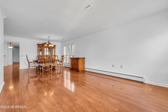 235 Prince Charles Ct, Toms River, NJ 08757 - dining room with a baseboard radiator, light wood finished floors, a chandelier, and baseboards