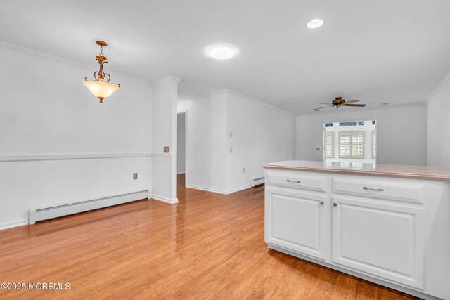 235 Prince Charles Ct, Toms River, NJ 08757 - kitchen featuring a baseboard heating unit, ornamental molding, ceiling fan, white cabinets, and hanging light fixtures