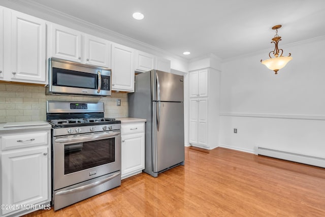 235 Prince Charles Ct, Toms River, NJ 08757 - kitchen featuring stainless steel appliances, light countertops, white cabinets, light wood-style floors, and tasteful backsplash
