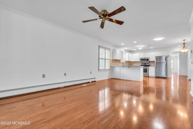235 Prince Charles Ct, Toms River, NJ 08757 - unfurnished living room with a baseboard heating unit, a ceiling fan, crown molding, light wood-style floors, and baseboards