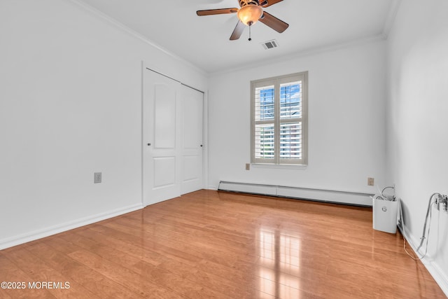 235 Prince Charles Ct, Toms River, NJ 08757 - unfurnished bedroom featuring a baseboard heating unit, crown molding, light wood-style flooring, ceiling fan, and a closet