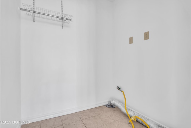 235 Prince Charles Ct, Toms River, NJ 08757 - laundry area with baseboards and tile patterned flooring