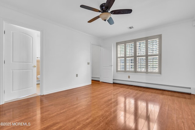 235 Prince Charles Ct, Toms River, NJ 08757 - unfurnished bedroom featuring a baseboard heating unit, ornamental molding, wood finished floors, and baseboards