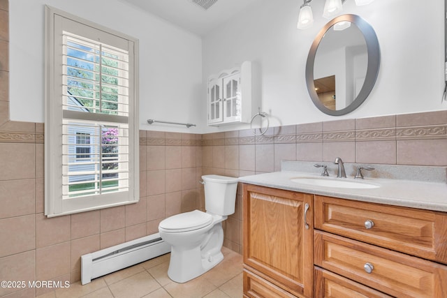 235 Prince Charles Ct, Toms River, NJ 08757 - bathroom featuring baseboard heating, tile walls, tile patterned floors, toilet, and vanity