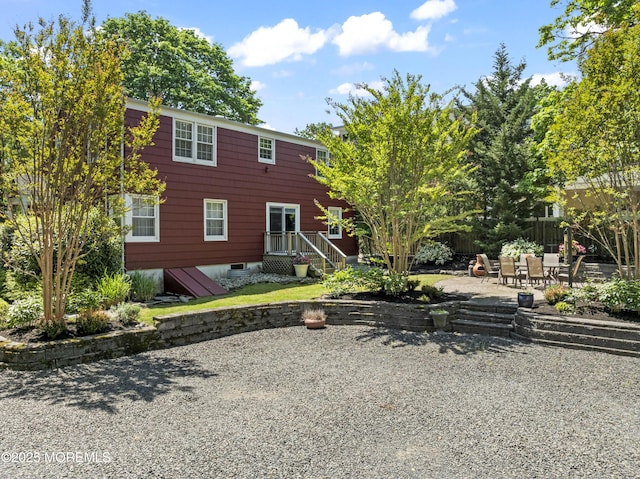 back of house featuring a patio area and fence