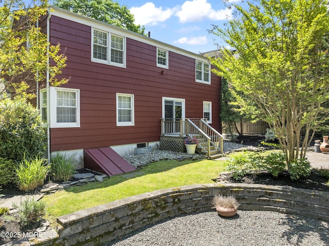 rear view of house with fence