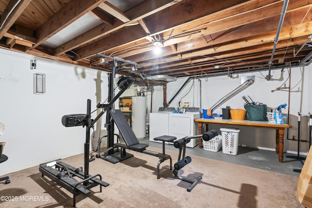 exercise area with washer and clothes dryer and gas water heater