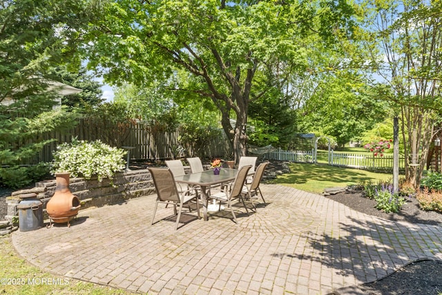 view of patio featuring outdoor dining area