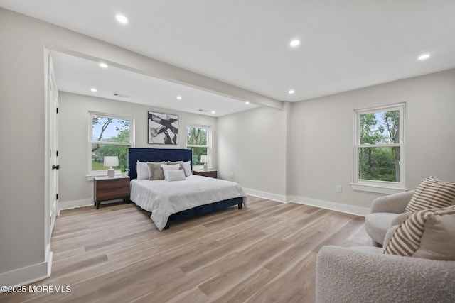 bedroom featuring recessed lighting, light wood-style flooring, and baseboards