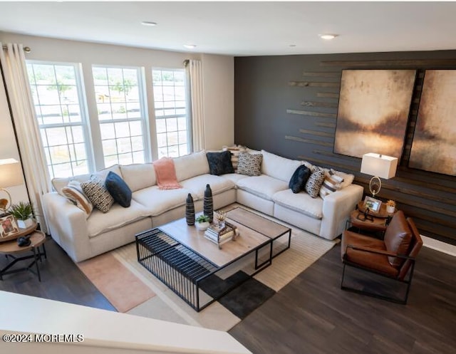 living room with wood finished floors and recessed lighting