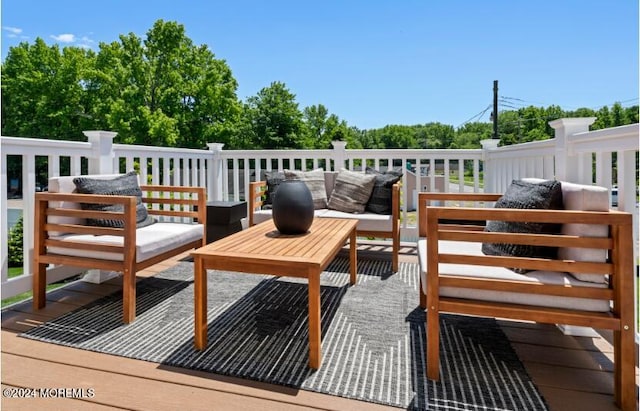 wooden deck featuring outdoor lounge area