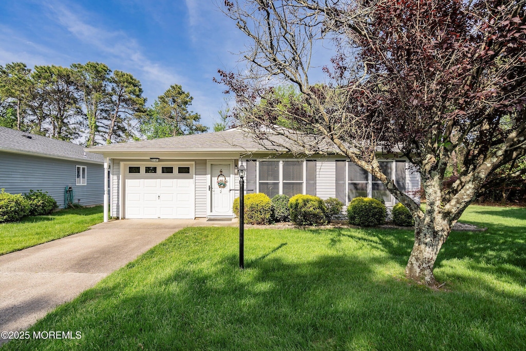 2 Ashford Dr, Brick, NJ 08723 - ranch-style house featuring driveway, an attached garage, and a front yard