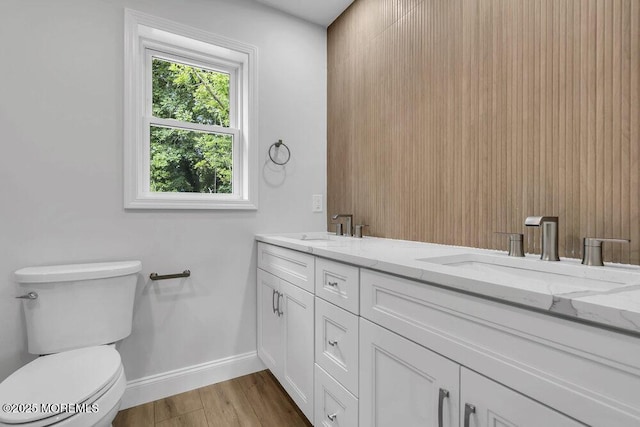 7 Leifried Ln, Tuckerton, NJ 08087 - bathroom featuring toilet, double vanity, wood finished floors, and baseboards