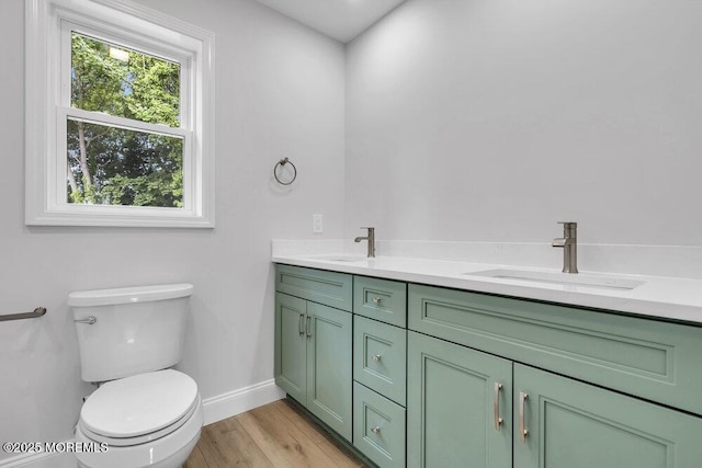 7 Leifried Ln, Tuckerton, NJ 08087 - bathroom with double vanity, toilet, wood finished floors, and baseboards