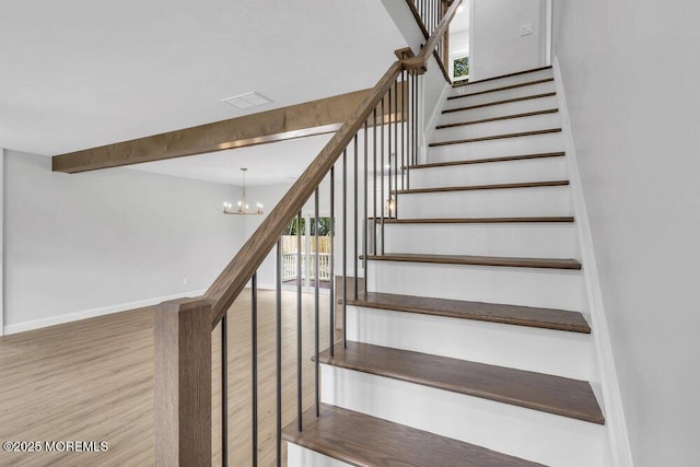 7 Leifried Ln, Tuckerton, NJ 08087 - staircase with wood finished floors, a chandelier, baseboards, and beam ceiling