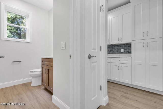 7 Leifried Ln, Tuckerton, NJ 08087 - bathroom with vanity, baseboards, wood finished floors, and toilet