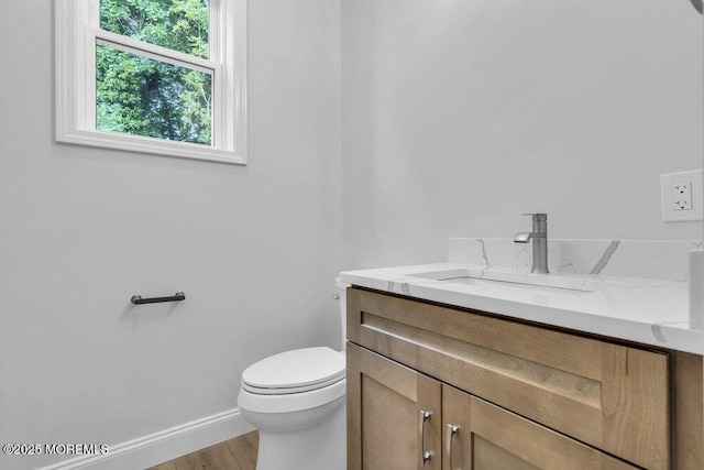 7 Leifried Ln, Tuckerton, NJ 08087 - half bathroom featuring vanity, toilet, wood finished floors, and baseboards