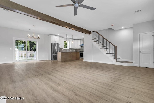 7 Leifried Ln, Tuckerton, NJ 08087 - unfurnished living room featuring a chandelier, a ceiling fan, light wood-type flooring, baseboards, and recessed lighting