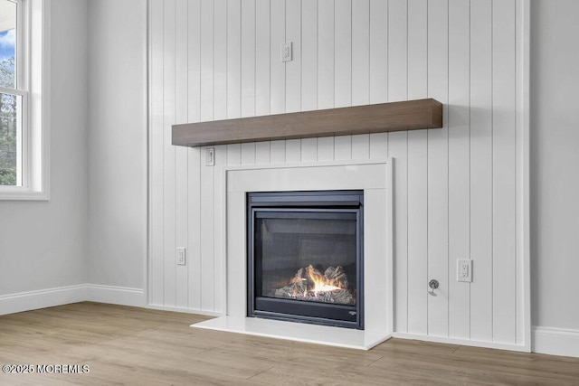 7 Leifried Ln, Tuckerton, NJ 08087 - detailed view of a glass covered fireplace, wood finished floors, and baseboards