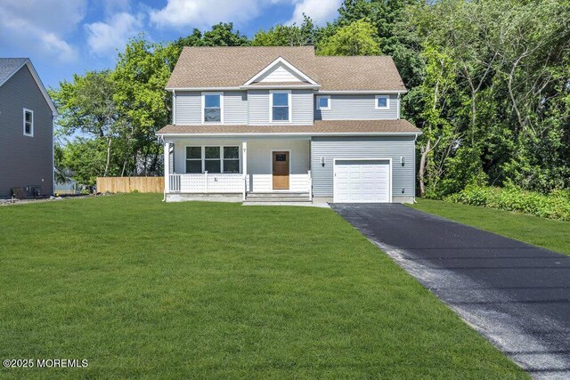 7 Leifried Ln, Tuckerton, NJ 08087 - view of front of house with asphalt driveway, a front yard, a porch, and a garage