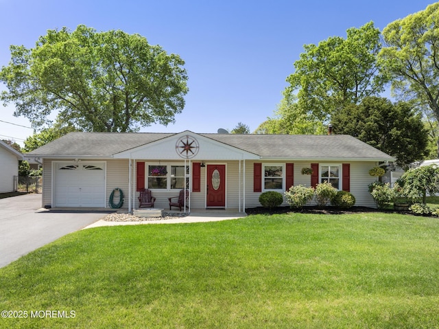 ranch-style house featuring asphalt driveway, an attached garage, and a front yard