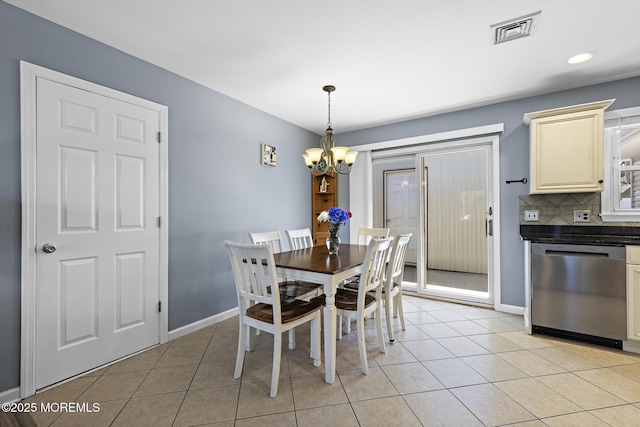 dining room with a chandelier, light tile patterned flooring, baseboards, and recessed lighting