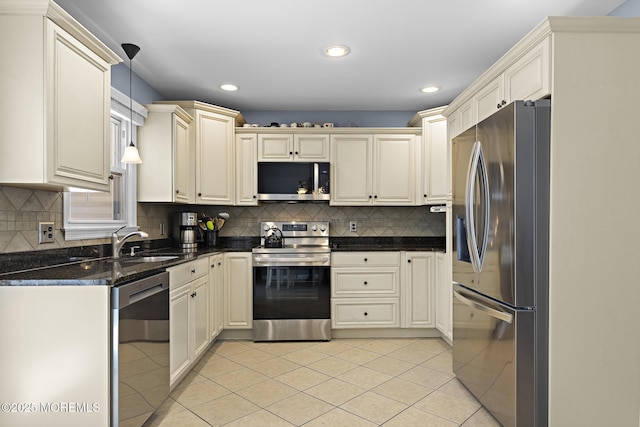 kitchen with appliances with stainless steel finishes, a sink, recessed lighting, light tile patterned flooring, and tasteful backsplash