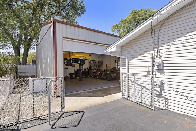 garage featuring fence