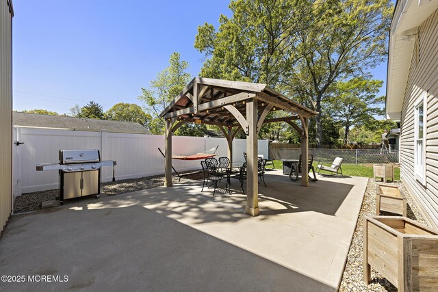 view of patio / terrace featuring area for grilling, outdoor dining space, a gazebo, and a fenced backyard